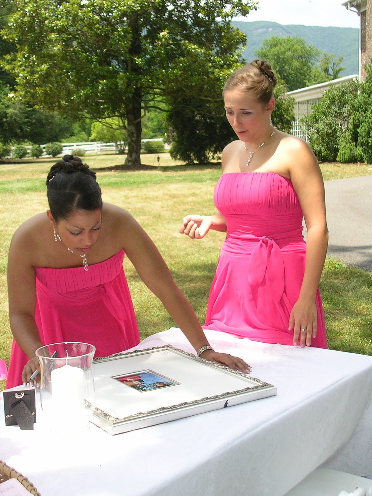 Tanya and Catherine sign.